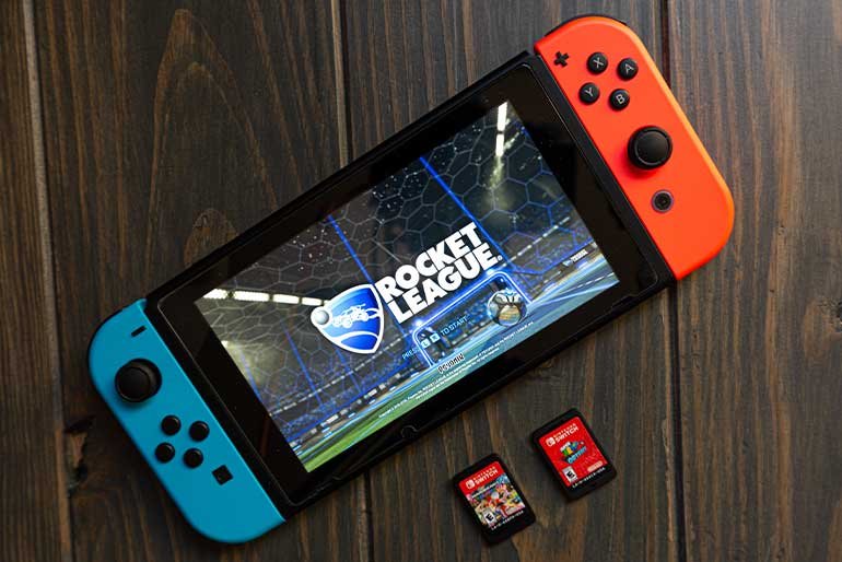 image of nintendo switch console and two games